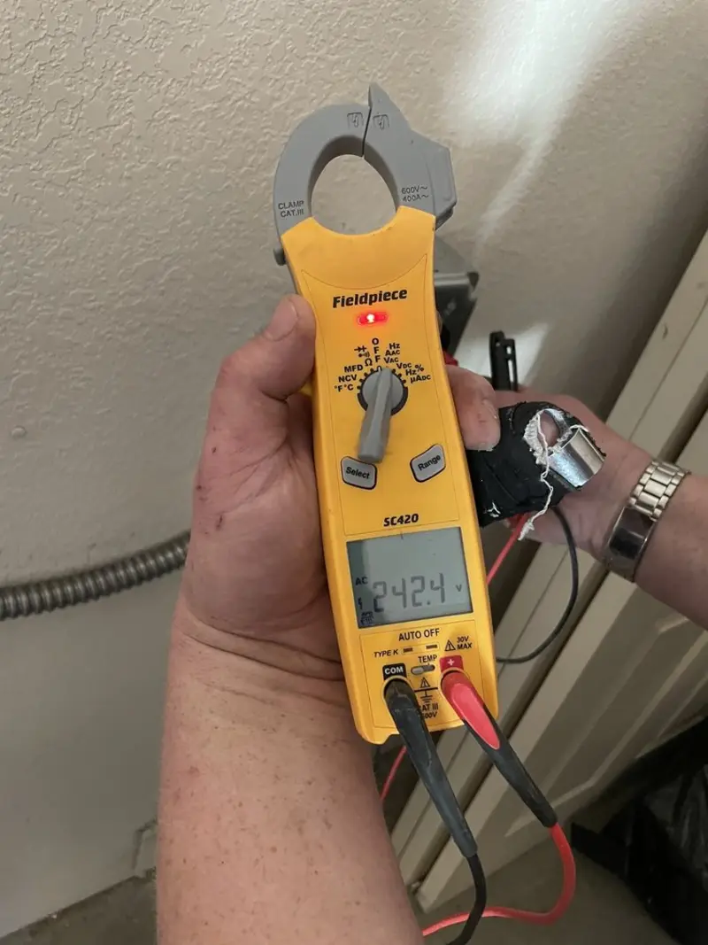 Voltage testing with clamp meter during Circuit Breaker Repair in Turner
